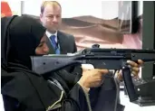  ??  ?? A woman fires an HK MP5 submachine gun in a simulator by Saab at a drone conference in Abu Dhabi, United Arab Emirates, on Sunday. ( AP Photo/ Jon Gambrell)