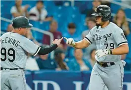  ?? CHRIS O’MEARA/AP ?? José Abreu celebrates his solo home run against the Tampa Bay Rays with third base coach Joe McEwing on Friday in St. Petersburg, Fla.