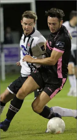  ??  ?? Eric Molloy of Wexford Youths is closely policed by Dundalk’s Ronan Finn.