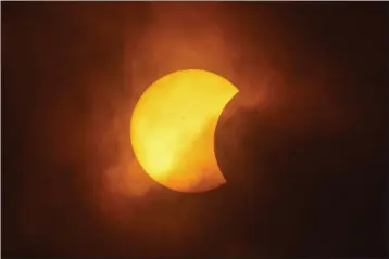  ?? ERIC GAY — THE ASSOCIATED PRESS ?? The moon partially covers the sun during a total solar eclipse Monday, as seen from Eagle Pass, Texas.