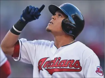  ?? DAVID DERMER — THE ASSOCIATED PRESS ?? The Indians’ Giovanny Ursula celebrates after hitting a single in the second inning against the Yankees.