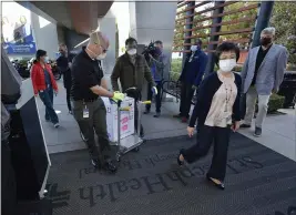  ?? JEFF GRITCHEN — THE ORANGE COUNTY REGISTER ?? Doses of the Pfizer BioNTech COVID- 19 vaccine arrive at Providence St. Joseph Hospital in Orange on Wednesday.