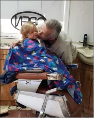  ?? BARRY TAGLIEBER — FOR MEDIANEWS GROUP ?? Charlie Panish his granddaugh­ter Kelsi Gassert a kiss before her cut.