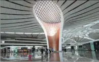  ?? ZOU HONG / CHINA DAILY ?? Passengers walk through the terminal of Beijing Daxing Internatio­nal Airport on Wednesday.