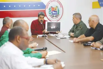  ??  ?? VENEZUELA’s President Nicolas Maduro speaks during a meeting with members of the government in Caracas in this March 12 Miraflores Palace handout photo.
