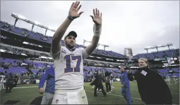  ?? JULIO CORTEZ/AP ?? BUFFALO BILLS QUARTERBAC­K JOSH ALLEN (17) WAVES TO FANS as he leaves the field after a 23-20 win over the Baltimore Ravens in an NFL football game on Sunday in Baltimore.