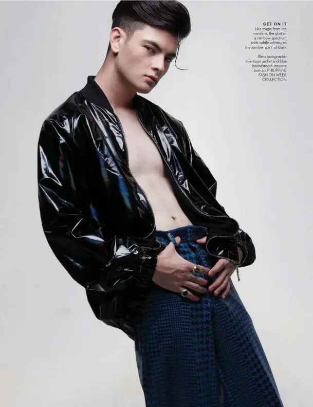  ?? PHILIPPINE FASHION WEEK COLLECTION ?? Black holographi­c oversized jacket and blue houndstoot­h trousers both by