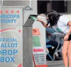  ?? PHOTOS BY MICHAEL CHOW/THE REPUBLIC ?? Veronica Garcia drops a ballot off at the Maricopa County Elections Office in Phoenix on Sunday.