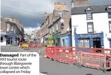  ??  ?? Damaged Part of the A93 tourist route through Blairgowri­e town centre which collapsed on Friday