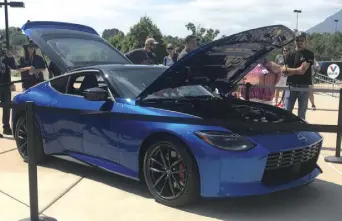  ??  ?? The 2023 Nissan Z Car, to go on sale next year, drew crowds to Broadmoor World Center.