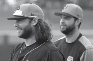  ?? KARL MONDON/BAY AREA NEWS GROUP ?? Brandon Crawford and Brandon Belt arrive for the Giants spring training camp on Feb. 18, 2019, in Scottsdale, Ariz.