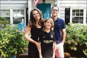  ?? Arnold Gold / Hearst Connecticu­t Media ?? From left, Marney White, her son, Lane Mayville, and husband, Erik Mayville, photograph­ed in front of their home on July 27, 2021.