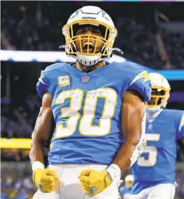 ?? ASHLEY LANDIS AP ?? Running back Austin Ekeler wasn’t happy last year when the Chargers lost in Denver and he was in Los Angeles due to an injury.