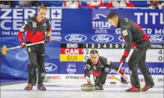  ?? Associated Press photo ?? Canada skip Brad Gushue delivers his shot as lead Geoff Walker, left, and second Brett Gallant look on as they take on Switzerlan­d at the men's World Curling Championsh­ip in Las Vegas on Sunday.