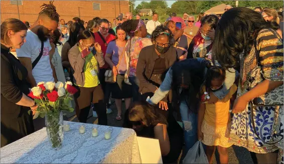  ?? EVAN BRANDT — MEDIANEWS GROUP ?? Relatives of those killed in Thursday’s home explosion on Hale Street break down in front of a picture board made by friends of some of the four children who died.