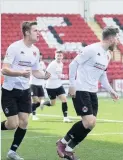  ??  ?? Joy Kristoffer Syvertsen and David Goodwillie celebrate