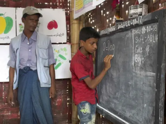  ?? (Photos Adam Withnall) ?? Rohingya refugees such as Hashim receive basic schooling