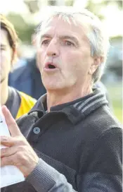  ??  ?? Lang Lang coach Joshua Collie tries to inspire his team during his quarter time address against Longwarry.