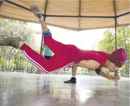  ?? (Photo: AP) ?? In this Tuesday, August 18, 2020 file photo, Carlos Cruz, a breakdance­r, practises at a kiosk in Alameda park which was closed off to the public for nearly five months due to the new coronaviru­s pandemic, in Mexico City. Breakdanci­ng has been confirmed as an official Olympic sport.
