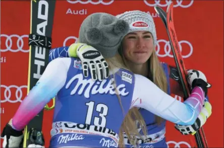  ?? ASSOCIATED PRESS ?? In this Friday file photo, United States’ Mikaela Shiffrin, third place in an alpine ski, women’s World Cup downhill, right, is hugged by second-placed United States’ Lindsey Vonn, in Cortina D’Ampezzo, Italy. Separated in age by about a decade,...