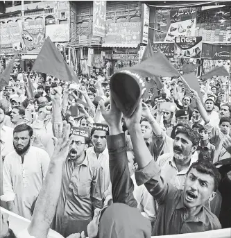  ?? MUHAMMAD SAJJAD THE ASSOCIATED PRESS ?? Supporters of Pakistan’s Awami National Party voice their rejection of the results in last week’s election during a demonstrat­ion in Peshawar on Sunday. Several political parties say vote rigging occurred in the July 25 election, and allege that the...