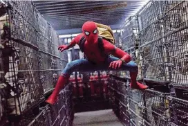  ?? [PHOTO BY CHUCK ZLOTNICK, COLUMBIA PICTURES-SONY/AP] ?? This image released by Columbia Pictures shows Tom Holland in a scene from “SpiderMan: Homecoming.”