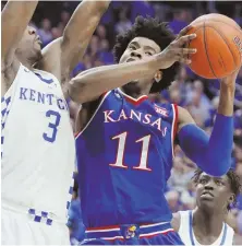  ?? AP PHOTO ?? COMING THROUGH: Kansas’ Josh Jackson drives to the basket against Kentucky’s Edrice Adebayo yesterday in Lexington, Ky.
