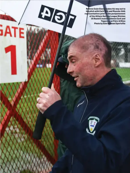  ??  ?? Referee Seán Cleere makes his way out to the pitch with Cork GAA and Munster GAA representa­tives prior to the postponeme­nt of the Allianz Hurling League Division 1A Round 5 match between Cork and Tipperary at Páirc Uí Rinn Photo by Eóin Noonan/Sportsfile