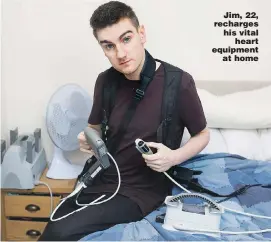  ?? Picture: LAURA DALE/CATERS ?? Jim, 22, recharges his vital heart equipment at home