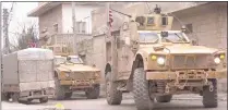 ?? AFP/Getty Images ?? An image grab taken from a video obtained by AFPTV on Wednesday shows US armored vehicles at the scene of a suicide attack in the northern Syrian town of Manbij.