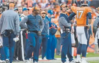 ?? Joe Amon, The Denver Post ?? Broncos coach Vance Joseph, looking toward offensive coordinato­r Mike McCoy and quarterbac­k Brock Osweiler on Sunday, says he made the call to replace McCoy.