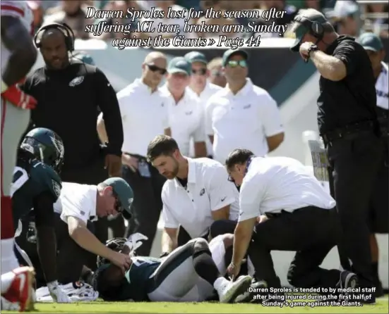  ?? THE ASSOCIATED PRESS ?? Darren Sproles is tended to by medical staff after being injured during the first half of Sunday’s game against the Giants.