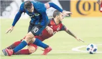  ?? RYAN REMIORZ/THE CANADIAN PRESS ?? Montreal Impact midfielder Ignacio Piatti, left, battles for the ball with Toronto FC forward Sebastian Giovinco on Saturday.