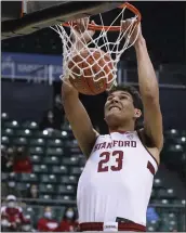  ?? MARCO GARCIA — THE ASSOCIATED PRESS ?? Stanford forward Brandon Angel dunks for two of his 17points against Liberty on Thursday in Honolulu.