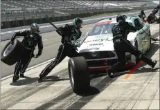  ?? MATT SLOCUM THE ASSOCIATED PRESS ?? Crew members hustle to service the car of Austin Cindric in a pit stop during the NASCAR Xfinity Series auto race at Pocono Raceway on Sunday in Long Pond, Pa.
