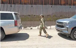  ??  ?? Arizona Department of Emergency and Military Affairs Brigadier General Kerry L. Muehlenbec­k leaves the news conference in Yuma.