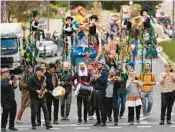  ?? OHAD ZWIGENBERG/AP ?? Performers play music during the Purim parade Monday in Jerusalem, its first in 42 years.