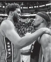  ?? DANIEL A. VARELA dvarela@miamiheral­d.com ?? The Heat’s Jimmy Butler, right, a teammate of Joel Embiid in Philadelph­ia, says ‘I feel bad for my guy.’