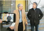  ?? JEFFERSON SIEGEL/THE NEW YORK TIMES ?? Donald Trump’s former lawyer Michael Cohen, right, arrives at the Manhattan district attorney’s office on Tuesday.