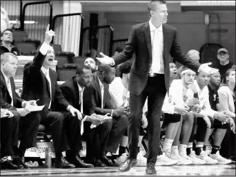  ?? RAY THOMPSON/AP ?? Valparaiso coach Matt Lottich looks for an explanatio­n against West Virginia during the game on Saturday.