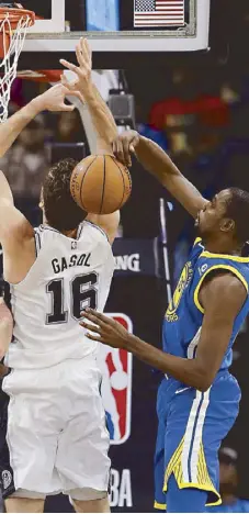  ?? AP ?? Golden State Warriors forward Kevin Durant blocks San Antonio Spurs center Pau Gasol (16) who tries to score during the first half of their game in San Antonio.