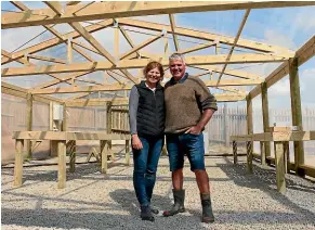  ??  ?? The plastic-clad house within the pa¯ walls will be used to propagate native trees for planting on their farm and for supplying others in the community.