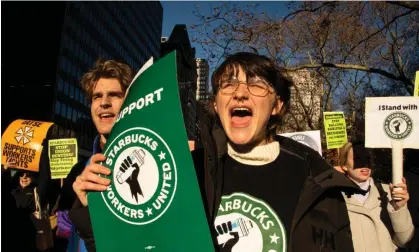  ?? Photograph: Laura Brett/Zuma/Rex/Shuttersto­ck ?? Starbucks workers and supporters rally at city hall in New York in December.