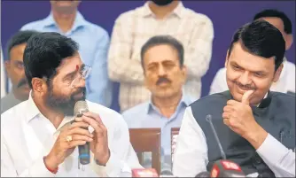  ?? SATISH BATE/HT PHOTO ?? Eknath Shinde and Devendra Fadnavis interact with the media before the swearing-in ceremony on Thursday.