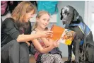  ??  ?? Vicki shares a moment with Georgie Farrell and her new school companion, assistance dog Lobo in 2018.