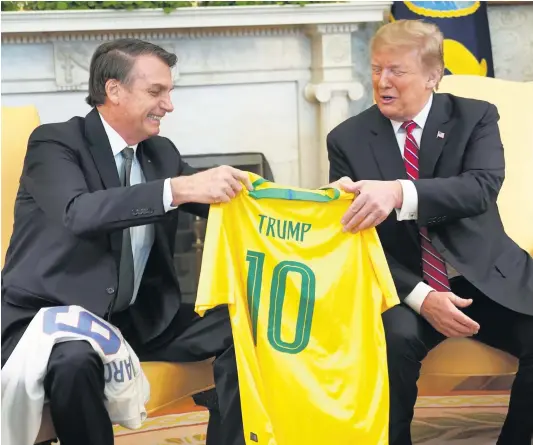  ??  ?? President of Brazil Jair Bolsonaro, left, and US President Donald Trump do not want to base their decisions on science and facts.