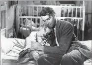  ?? Hulton archive/Getty images/Tns ?? James Stewart as George Bailey, hugs actor Karolyn Grimes, who plays his daughter Zuzu, in “It’s a Wonderful Life.”