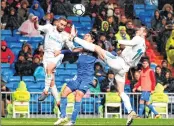  ??  ?? Real Madrid's Gareth Bale (R) and Dani Carvajal (L) vie with Getafe's Gaku Shibasaki during the Spanish league football match at the Santiago Bernabeu stadium in Madrid.