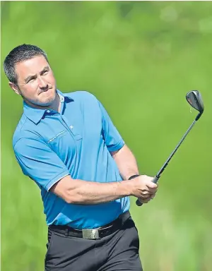  ?? Photograph­s by Colin Rennie ?? GOING WELL: Ross McConnachi­e in action at the third hole. The Peterculte­r player is well up the field after carding a three-over-par 57.