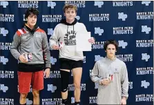  ?? KEV HUNTER — MEDIANEWS GROUP ?? Pennridge’s Quinn McBride (middle) receives his first-place medal at 121pounds, with Souderton Area’s Charlie Arobone (left) placing second and Central Bucks West’s Martin Scollins taking third.